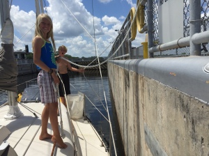 The kids handling the lines in a lock